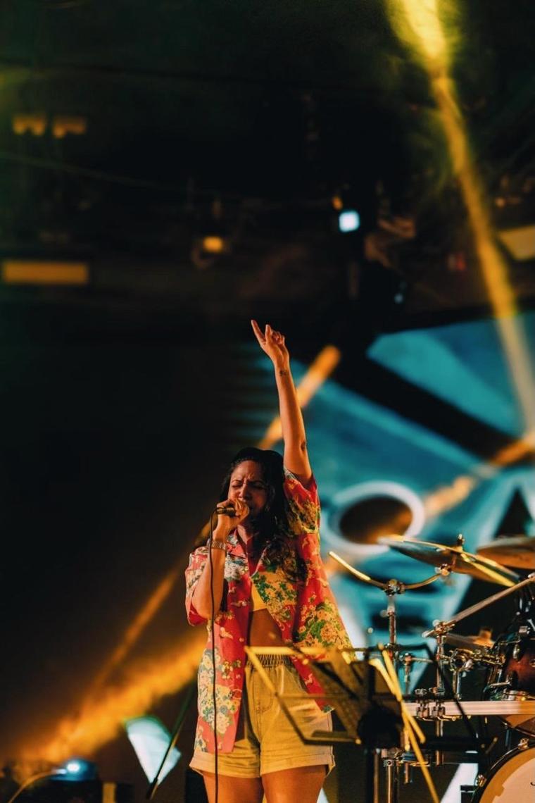 Jeane on stage — golden lights